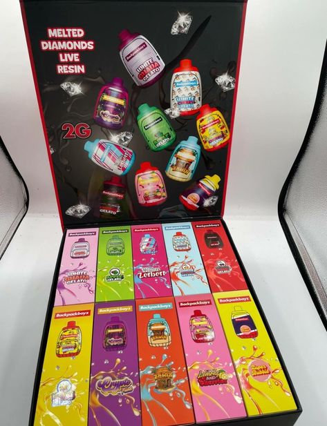 A display case filled with an assortment of colorful candy flavors, showcasing the variety offered by Backpackboyz.